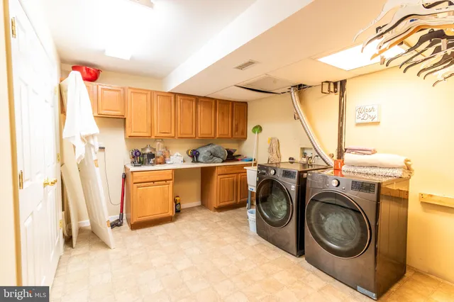 a view of a storage & utility room with washer and dryer