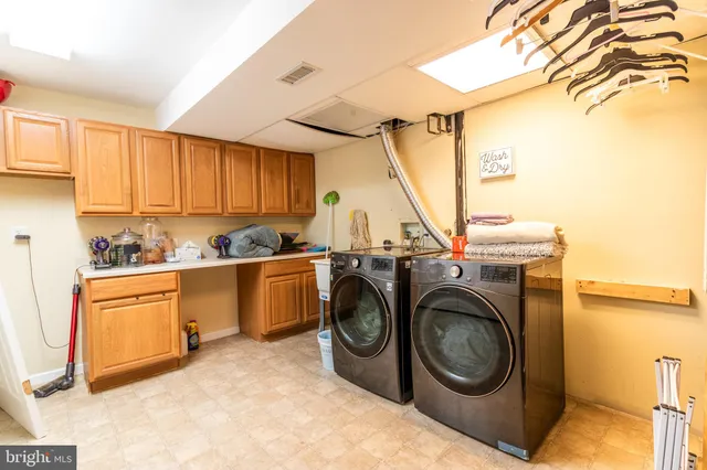 a view of a storage & utility room with washer and dryer