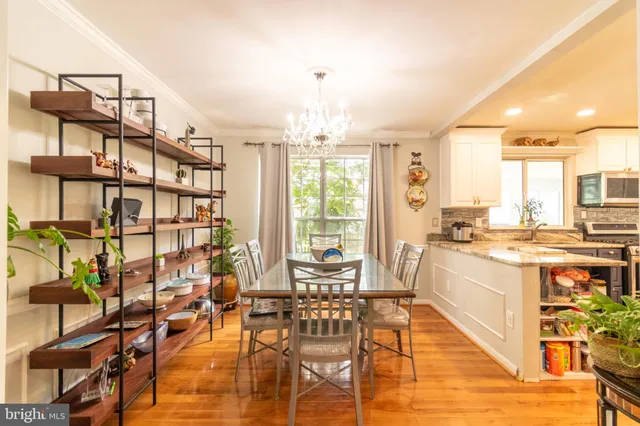 a large kitchen with a lot of counter space and windows