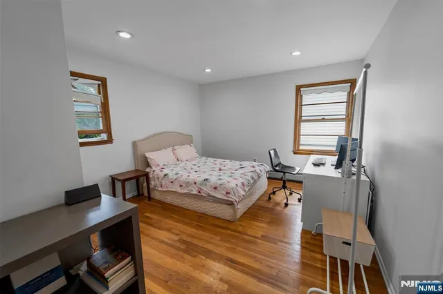 a bedroom with a bed and a desk