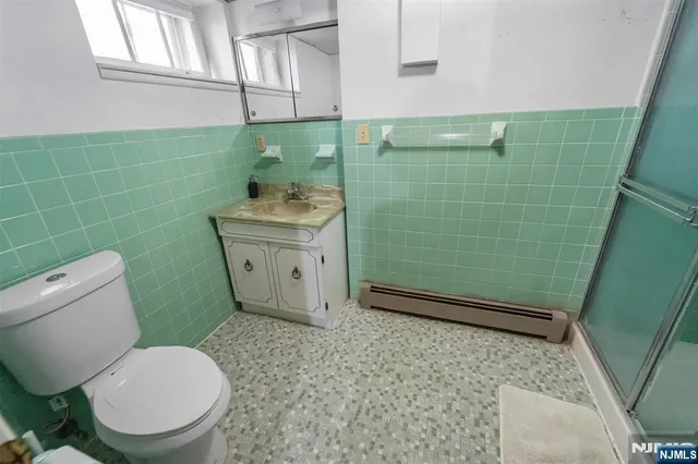 a bathroom with a toilet and a sink