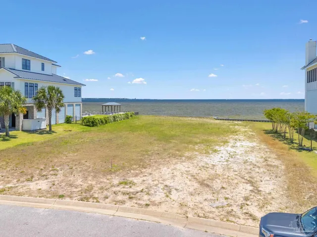 an aerial view of a house with a ocean view