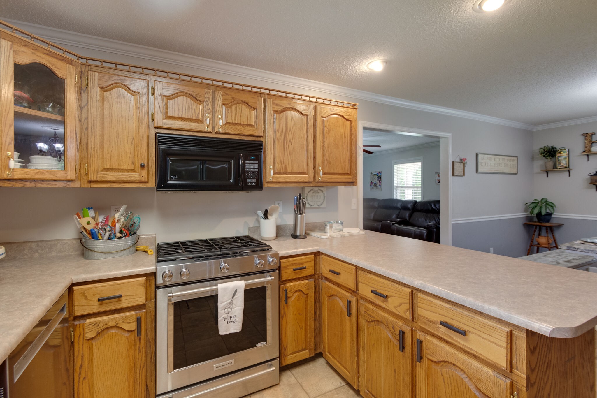 1155 Johnson Branch Road Pulaski, TN 38478 - Photo 12 of 45 a kitchen with stainless steel appliances granite countertop a stove a sink and a microwave