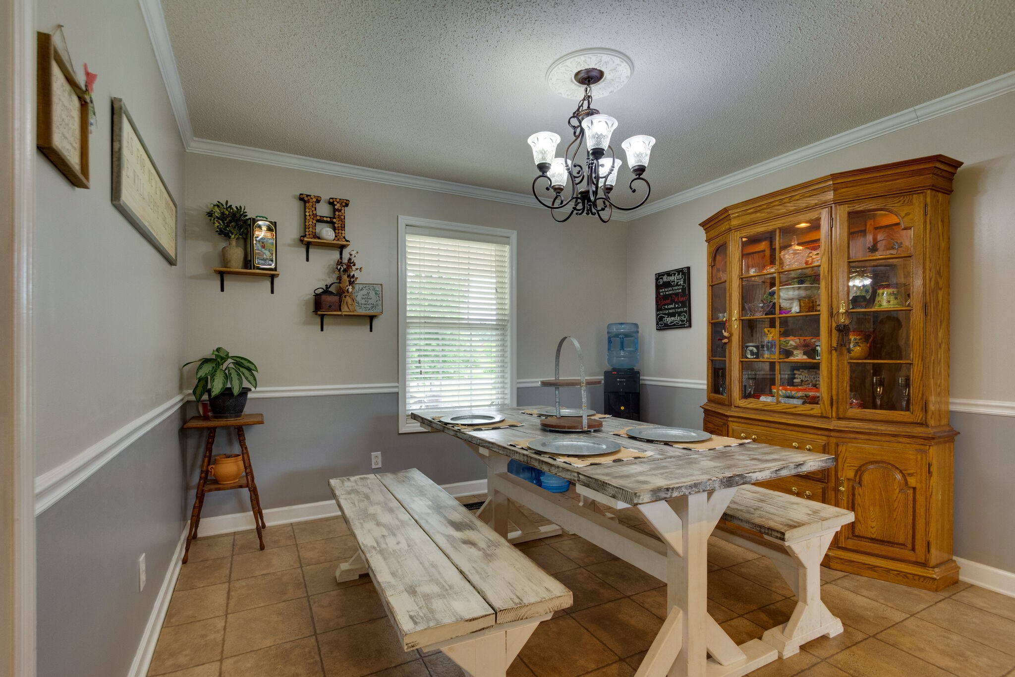 1155 Johnson Branch Road Pulaski, TN 38478 - Photo 13 of 45 a view of a dining room with furniture a livingroom and chandelier