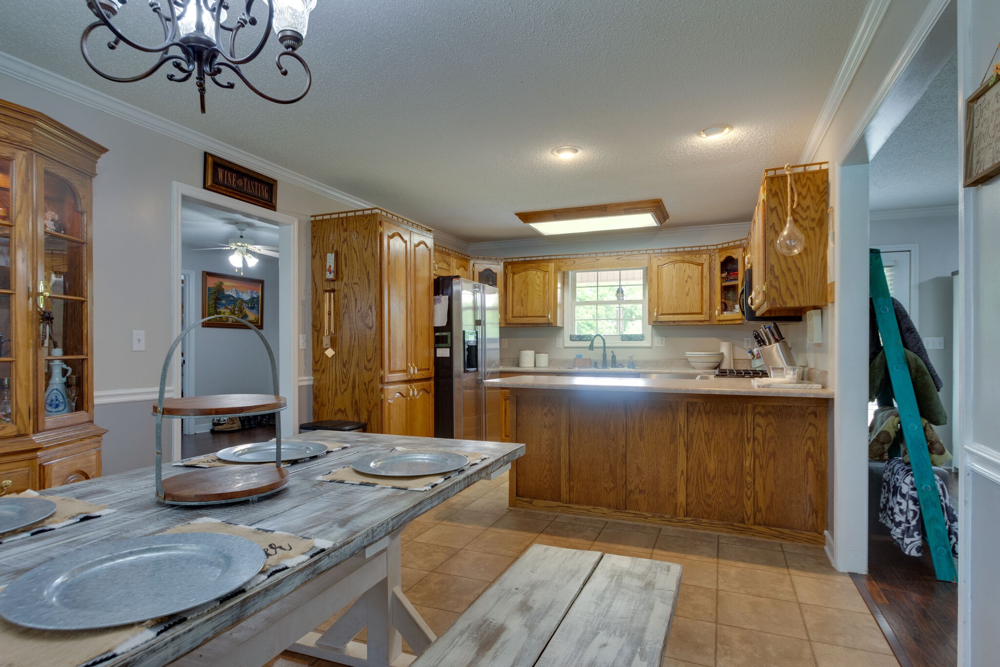 1155 Johnson Branch Road Pulaski, TN 38478 - Photo 15 of 45 a kitchen with kitchen island granite countertop a sink and a stove