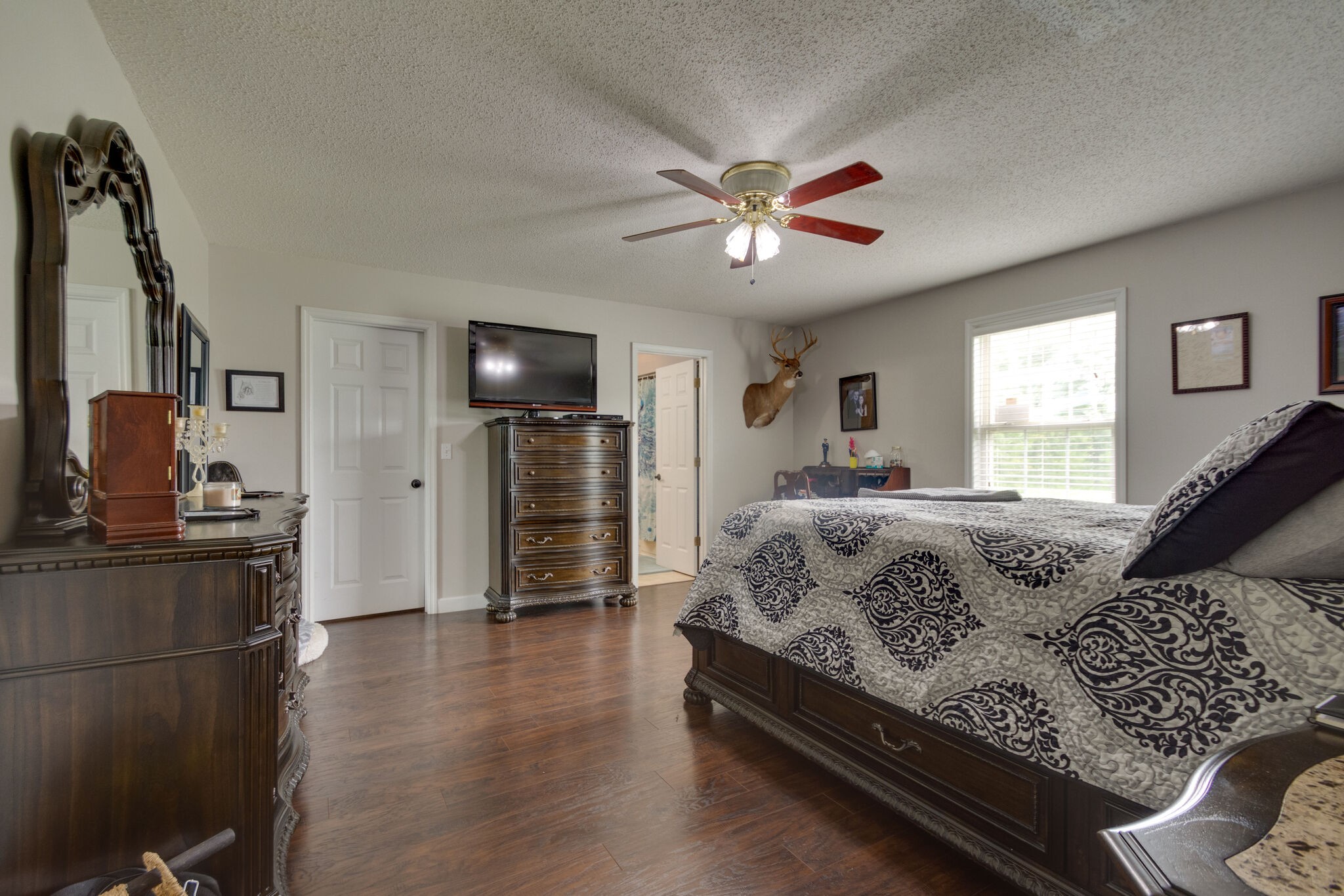 1155 Johnson Branch Road Pulaski, TN 38478 - Photo 20 of 45 a spacious bedroom with a bed and wooden floor