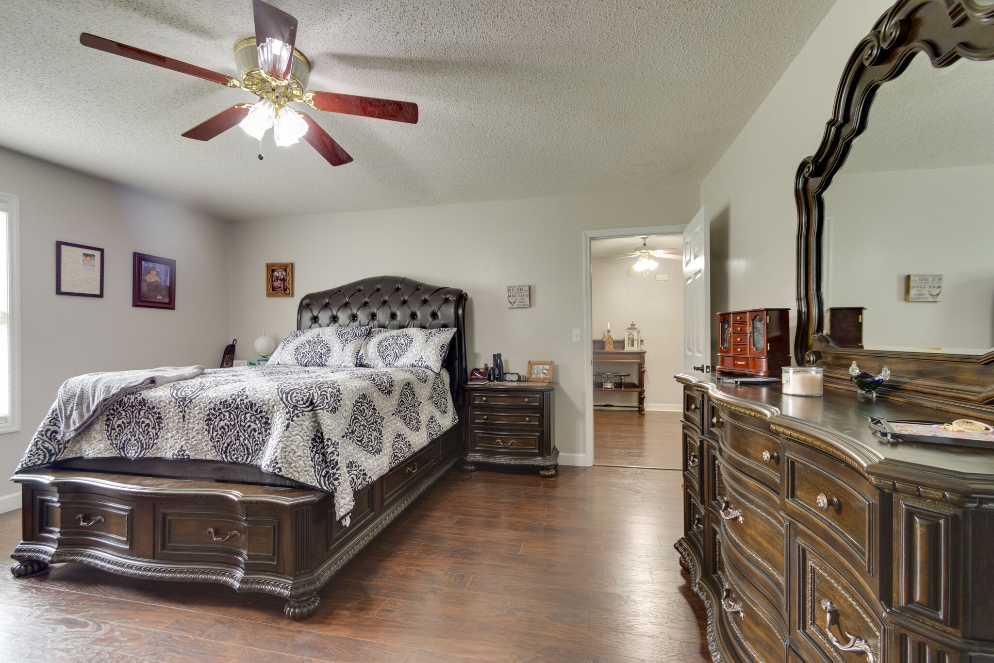 1155 Johnson Branch Road Pulaski, TN 38478 - Photo 21 of 45 a spacious bedroom with a bed and a chandelier