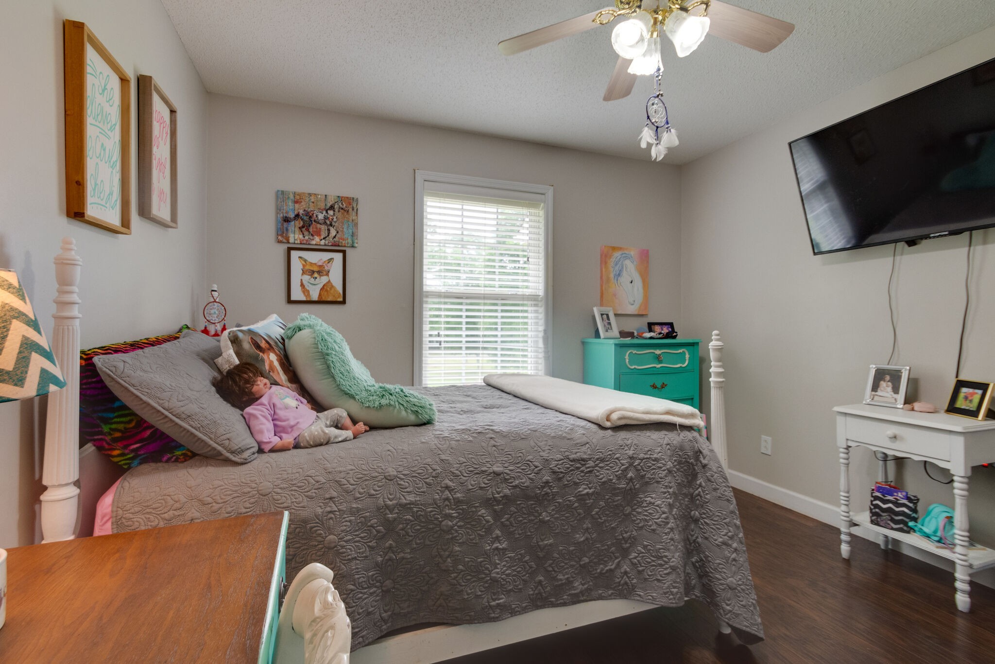 1155 Johnson Branch Road Pulaski, TN 38478 - Photo 29 of 45 a bedroom with a bed and a flat screen tv