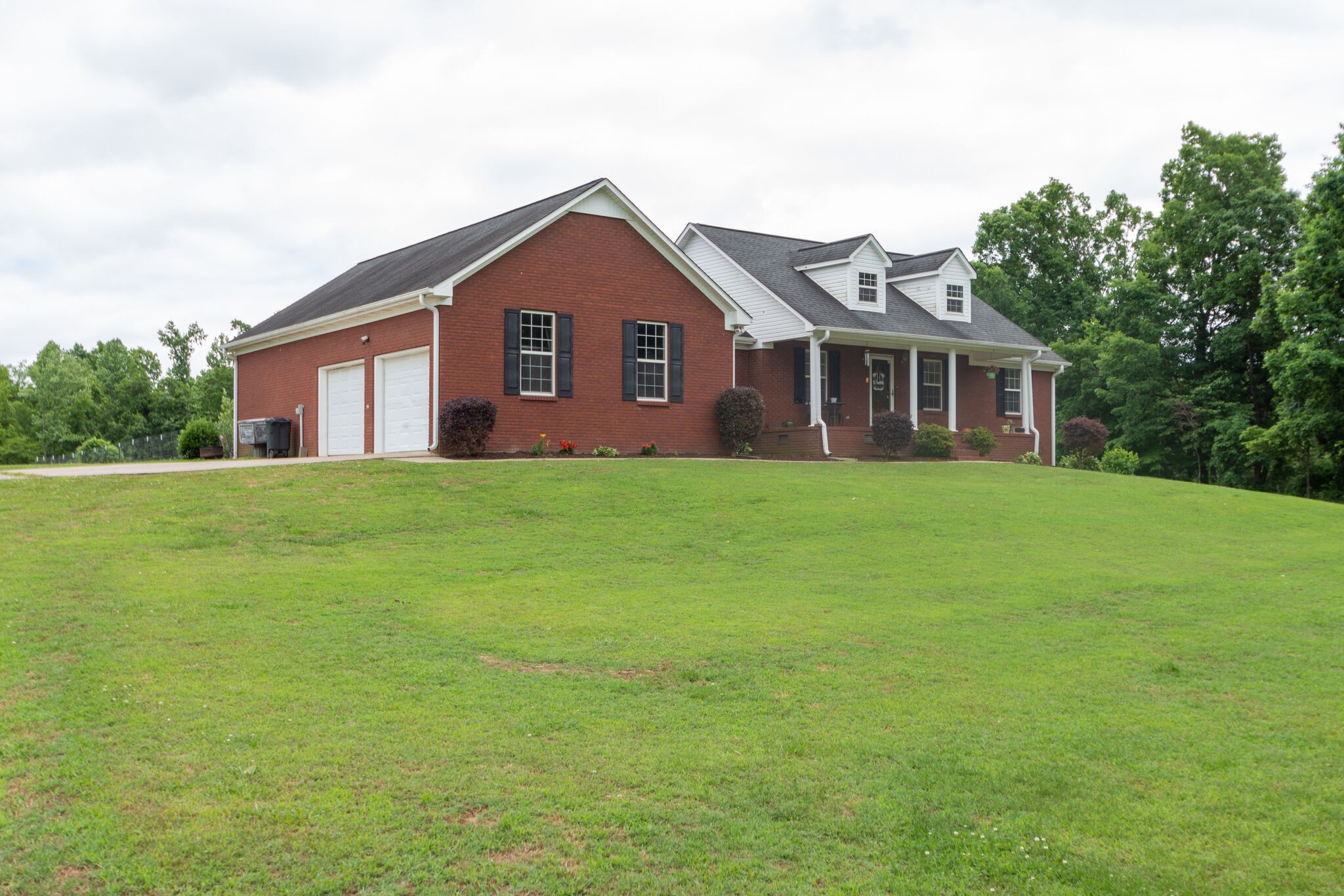 1155 Johnson Branch Road Pulaski, TN 38478 - Photo 3 of 45 a front view of a house with a yard