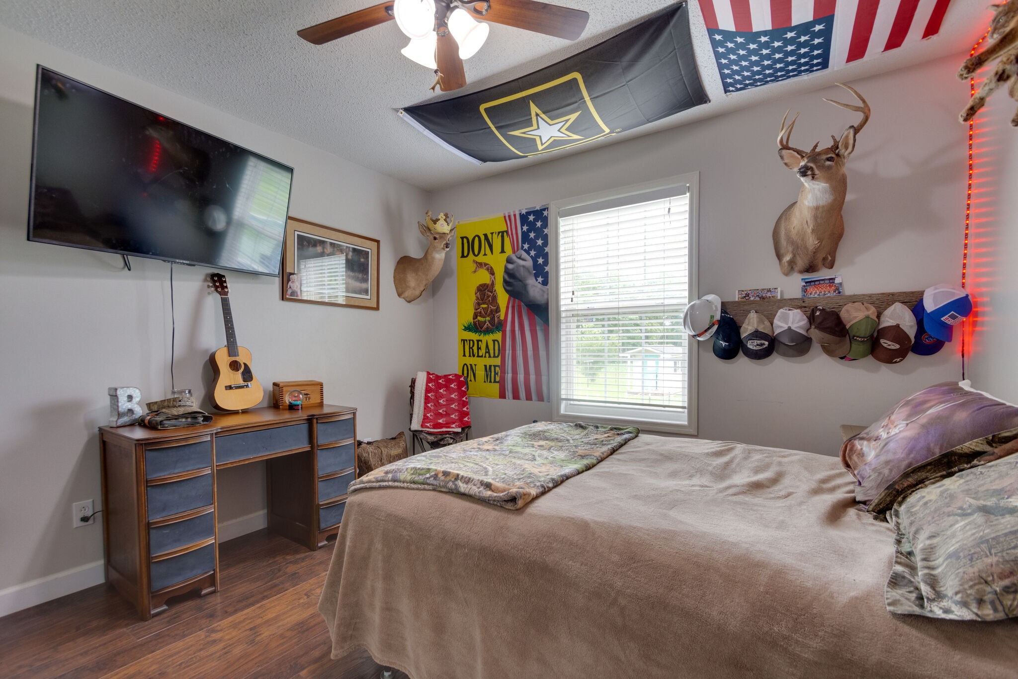 1155 Johnson Branch Road Pulaski, TN 38478 - Photo 33 of 45 a bedroom with a bed and a flat screen tv