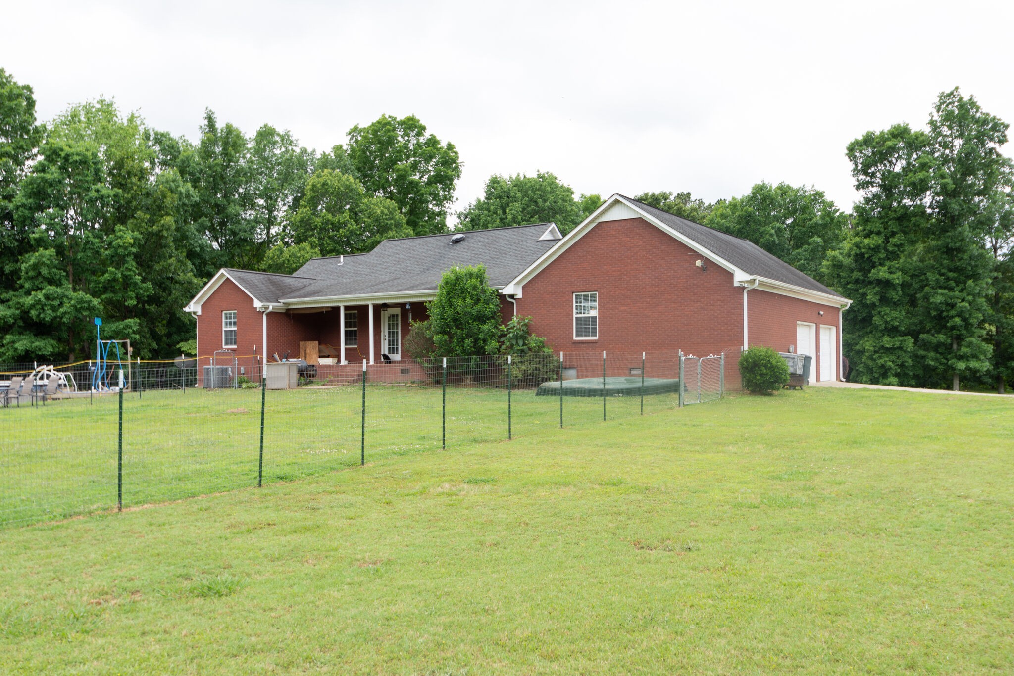 1155 Johnson Branch Road Pulaski, TN 38478 - Photo 40 of 45 a view of house with a big yard and large trees