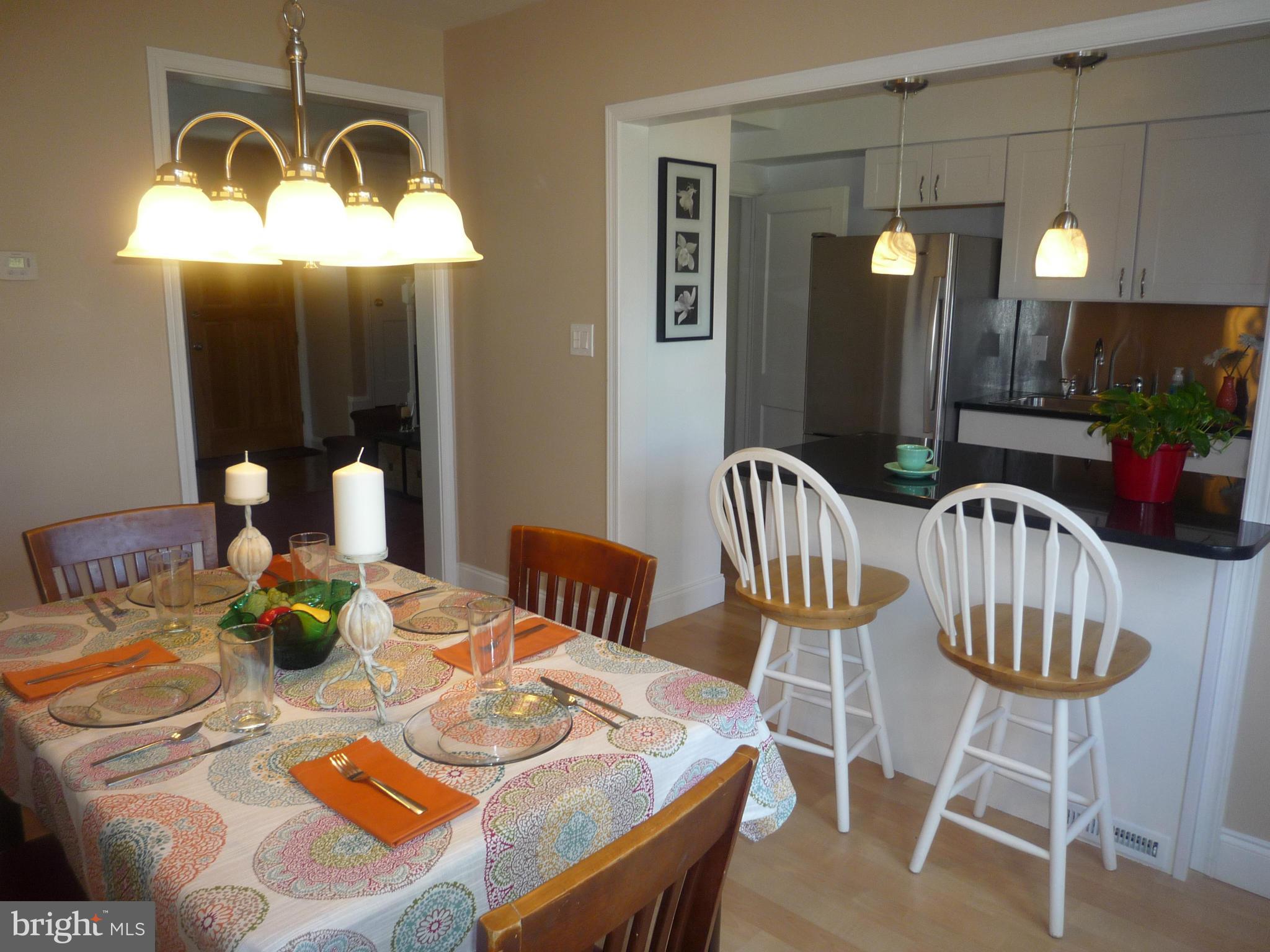 1042 Upnor Road Baltimore, MD 21212 - Photo 12 of 30 a view of a dining room with furniture window and wooden floor