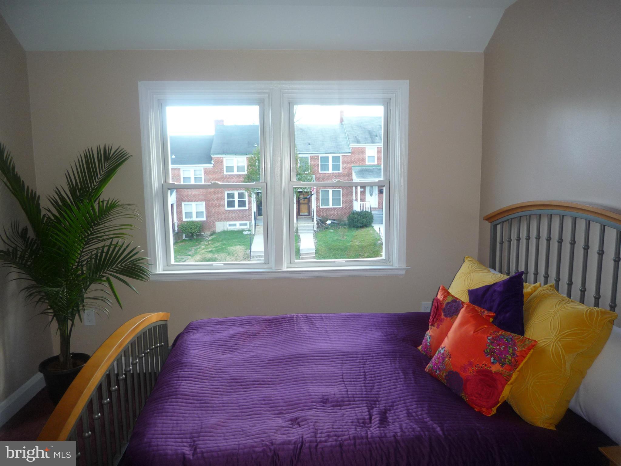 1042 Upnor Road Baltimore, MD 21212 - Photo 21 of 30 a room with furniture and a potted plant