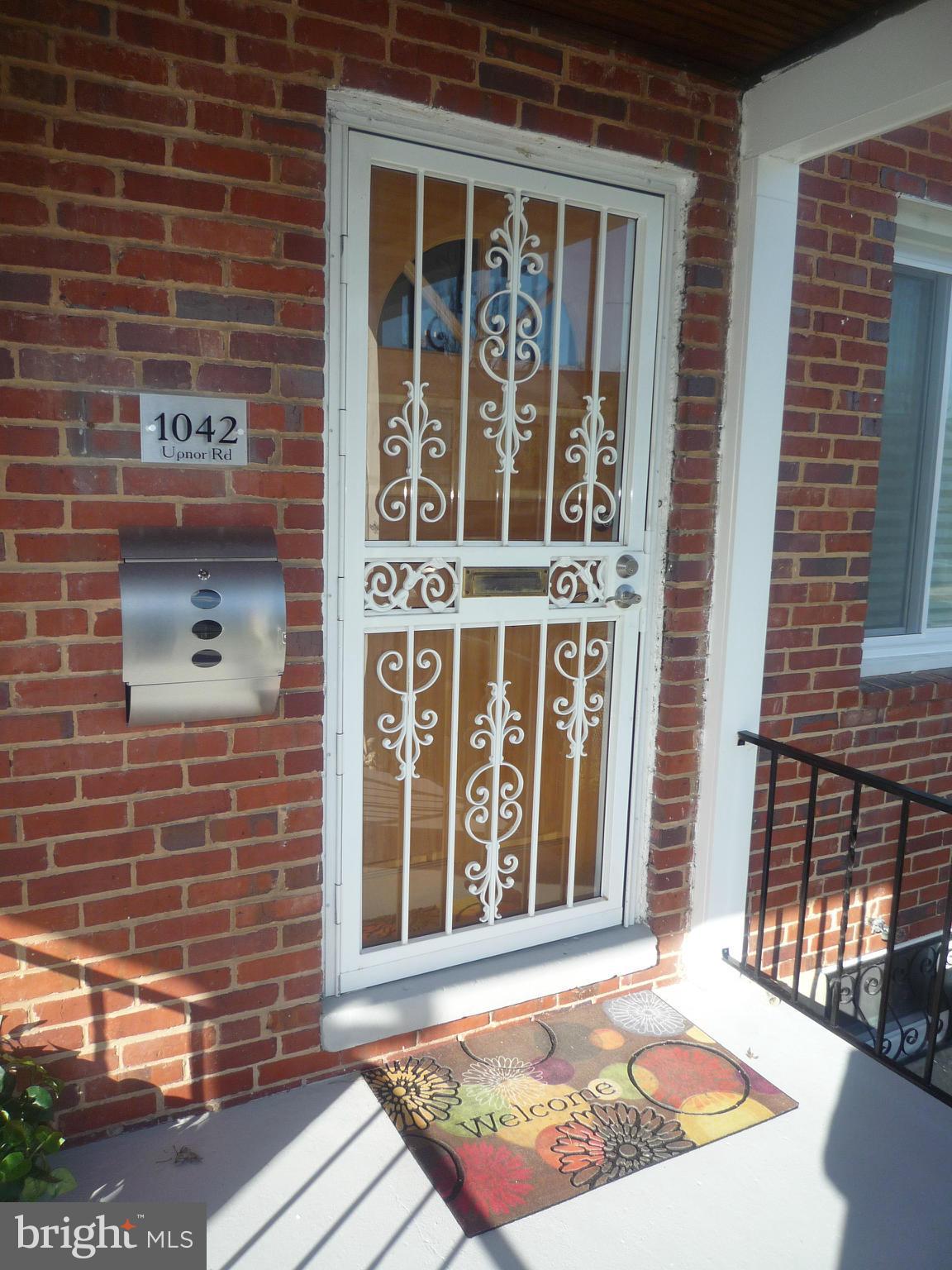1042 Upnor Road Baltimore, MD 21212 - Photo 4 of 30 a view of a brick buildings with entryway