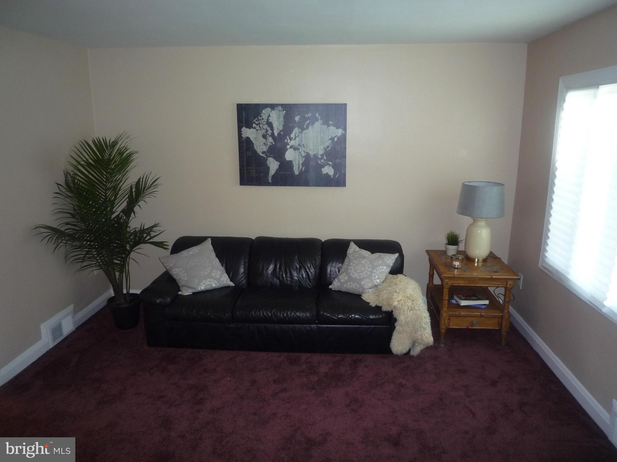 1042 Upnor Road Baltimore, MD 21212 - Photo 7 of 30 a living room with furniture and a window