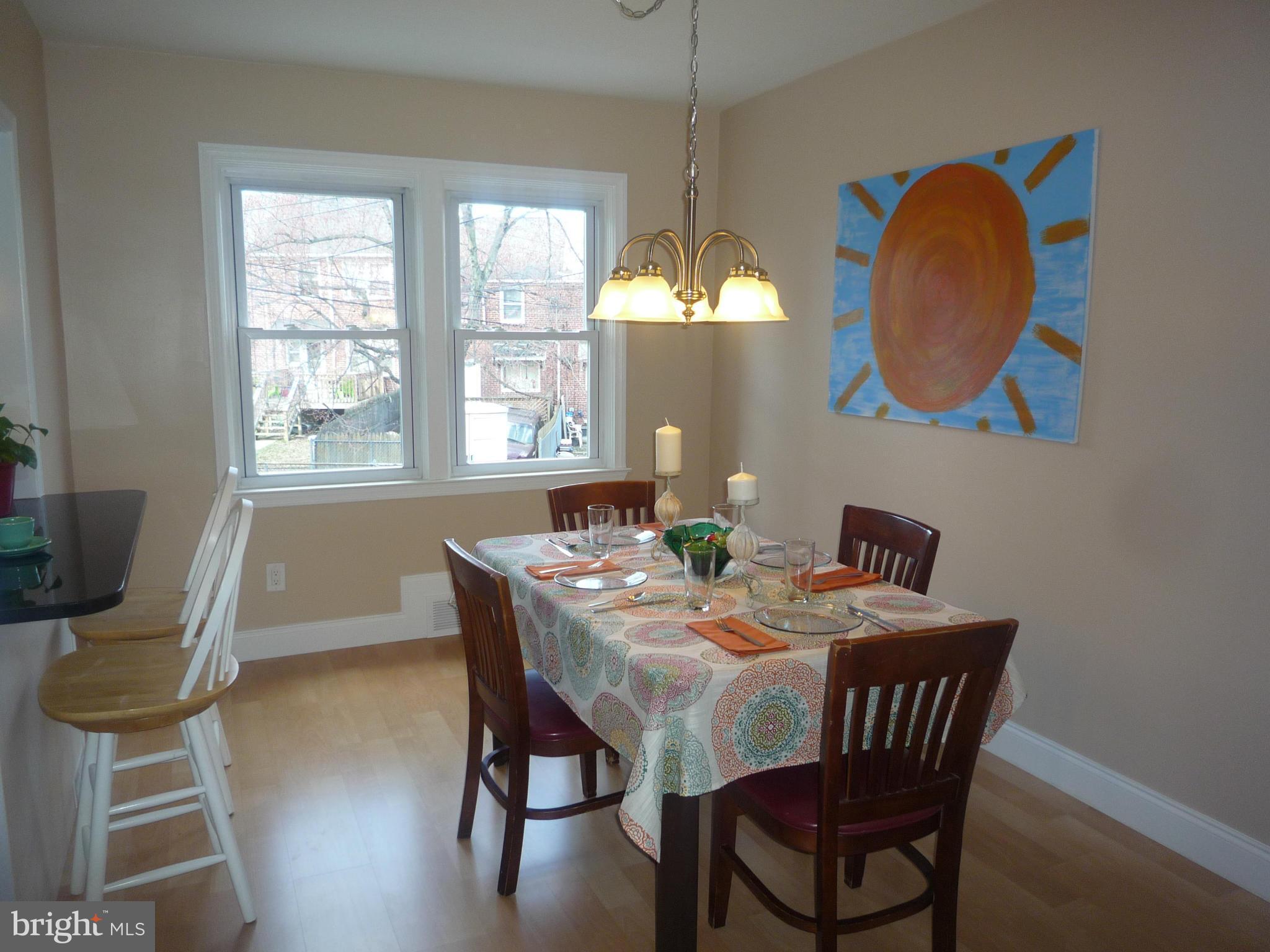 1042 Upnor Road Baltimore, MD 21212 - Photo 9 of 30 a view of a dining room with furniture window and wooden floor