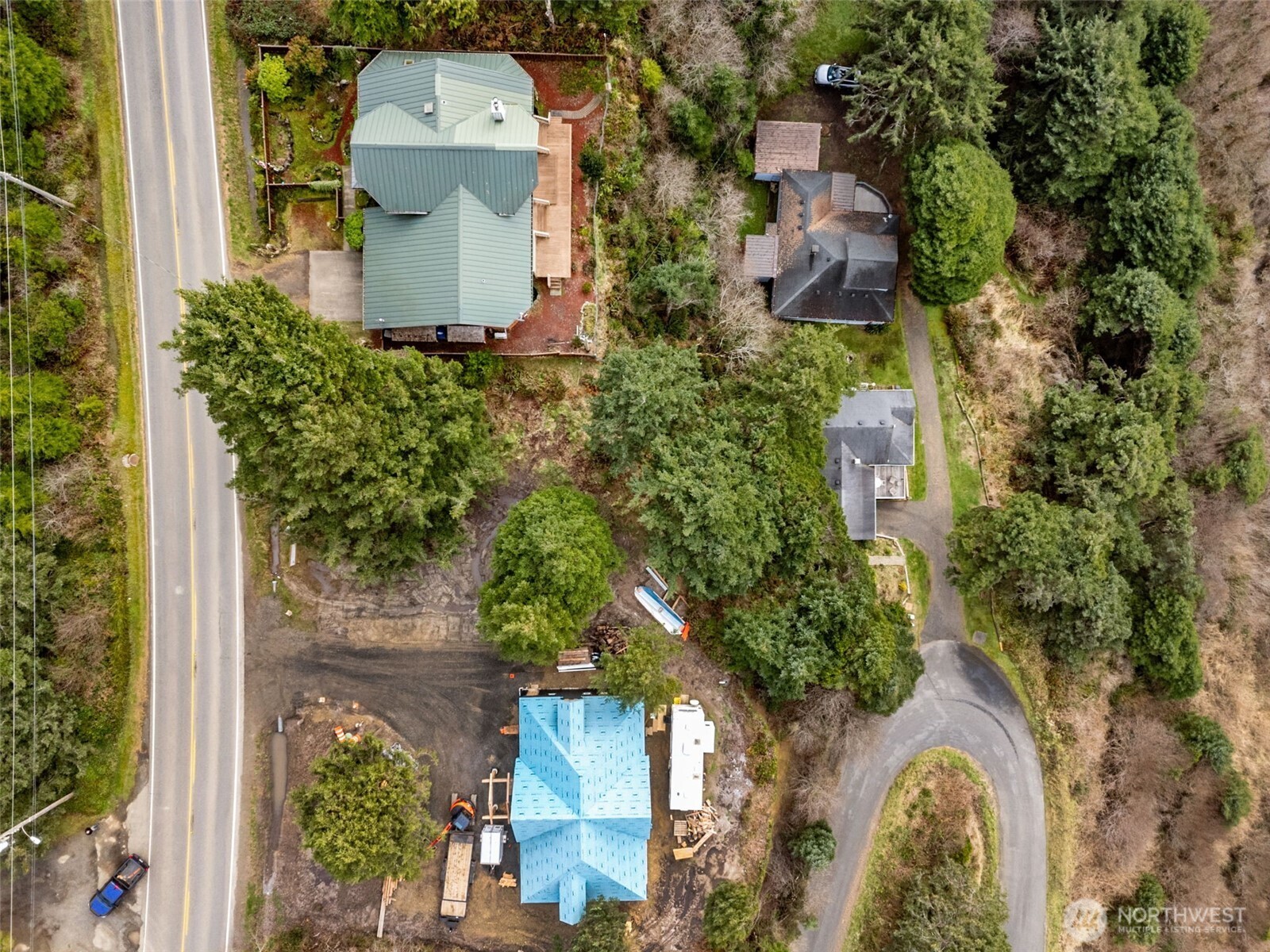 4659 State Route 109 Moclips, WA 98562 - Photo 6 of 17 an aerial view of a house with a yard and greenery