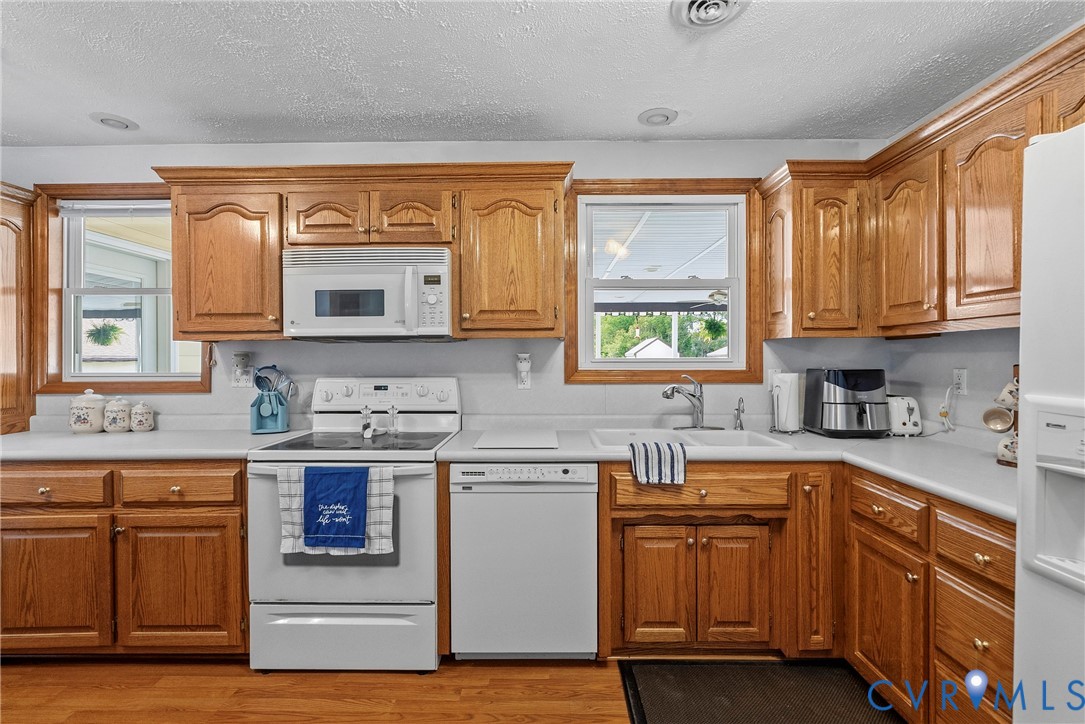18024 Sandy Ford Road Petersburg, VA 23803 - Photo 19 of 66 a kitchen with stainless steel appliances granite countertop a sink stove and cabinets