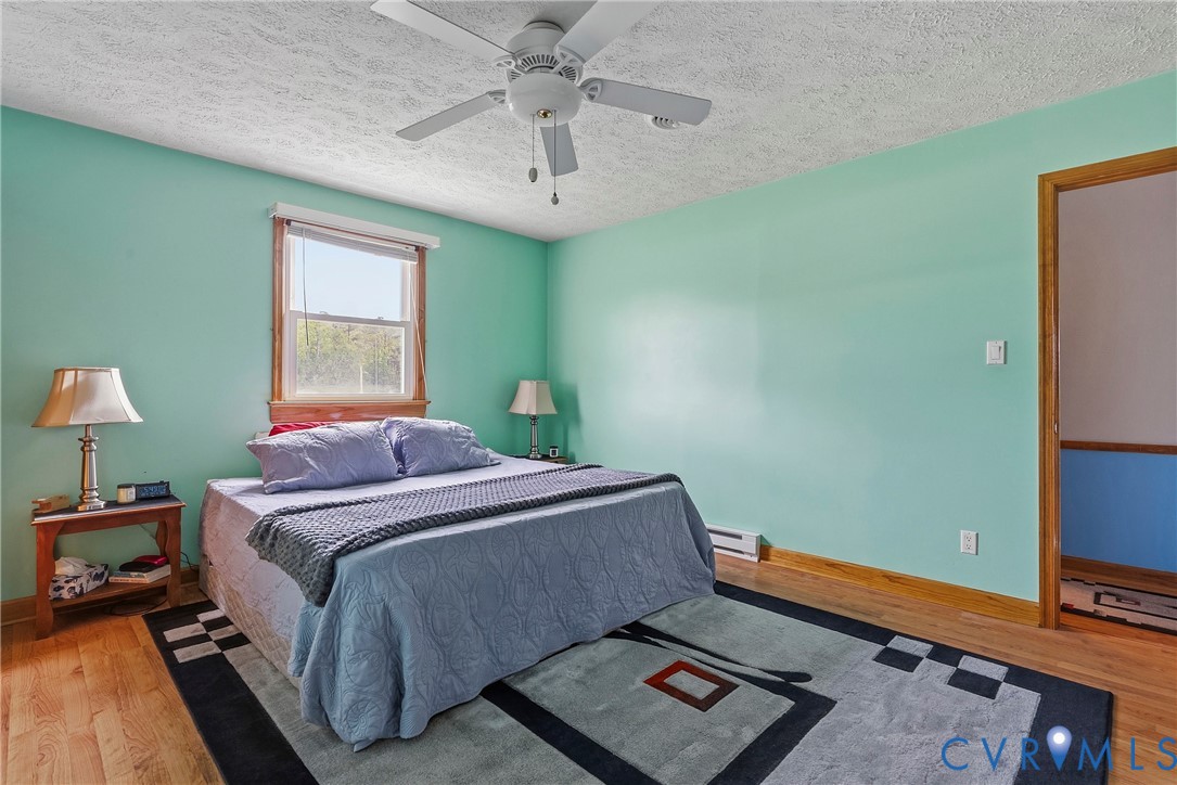 18024 Sandy Ford Road Petersburg, VA 23803 - Photo 23 of 66 a bedroom with a bed and a window