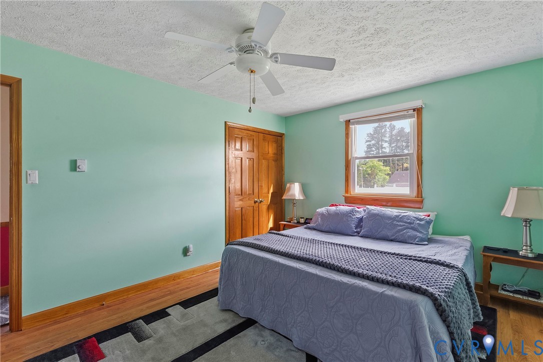 18024 Sandy Ford Road Petersburg, VA 23803 - Photo 24 of 66 a bedroom with a bed and a window