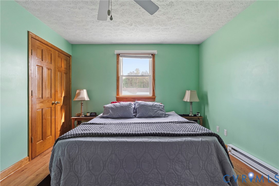 18024 Sandy Ford Road Petersburg, VA 23803 - Photo 25 of 66 a bedroom with a bed and window