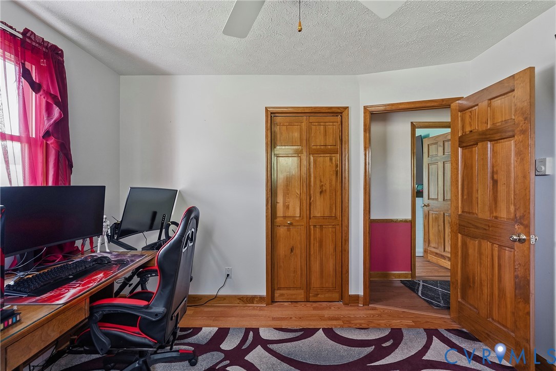 18024 Sandy Ford Road Petersburg, VA 23803 - Photo 31 of 66 a view of a workspace with furniture and musical instruments