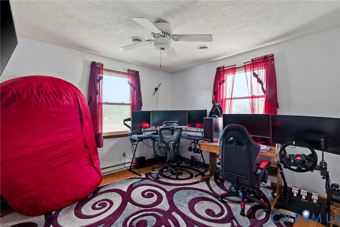 18024 Sandy Ford Road Petersburg, VA 23803 - Photo 32 of 66 a living room with furniture a rug and a window