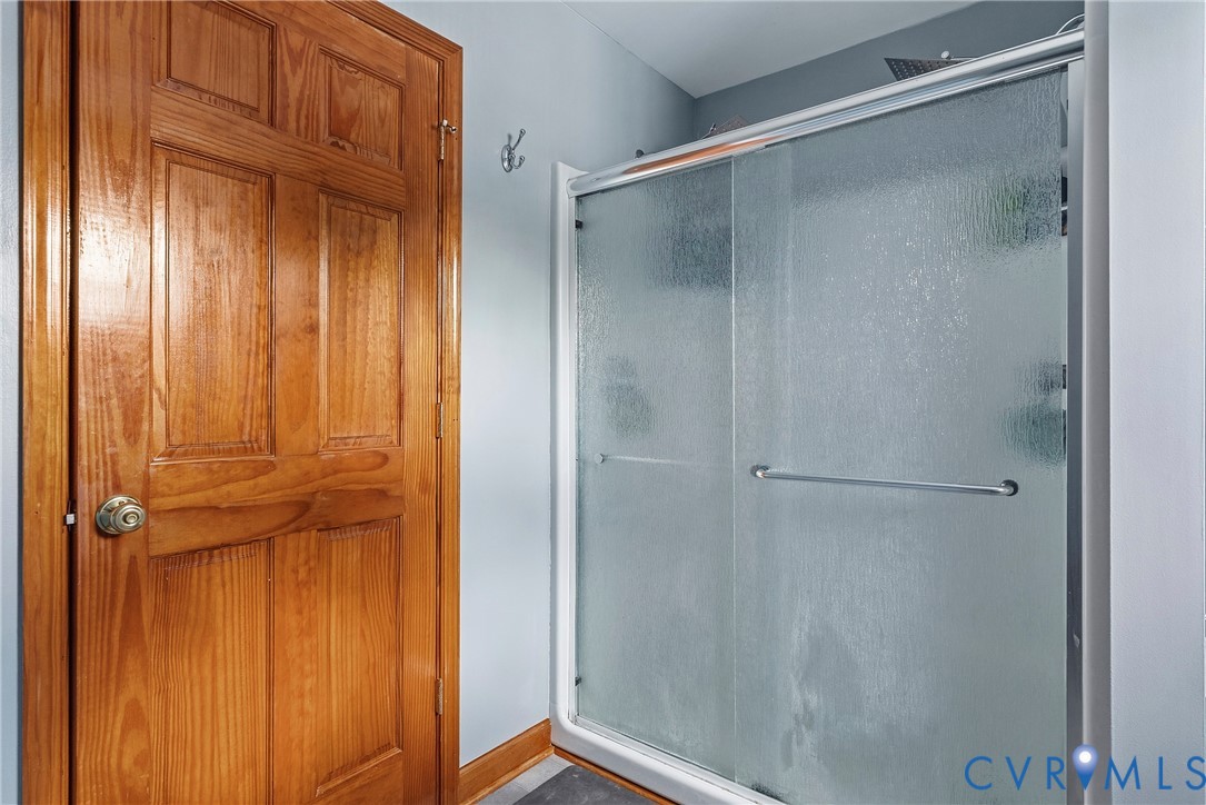 18024 Sandy Ford Road Petersburg, VA 23803 - Photo 33 of 66 a bathroom with a glass door shower