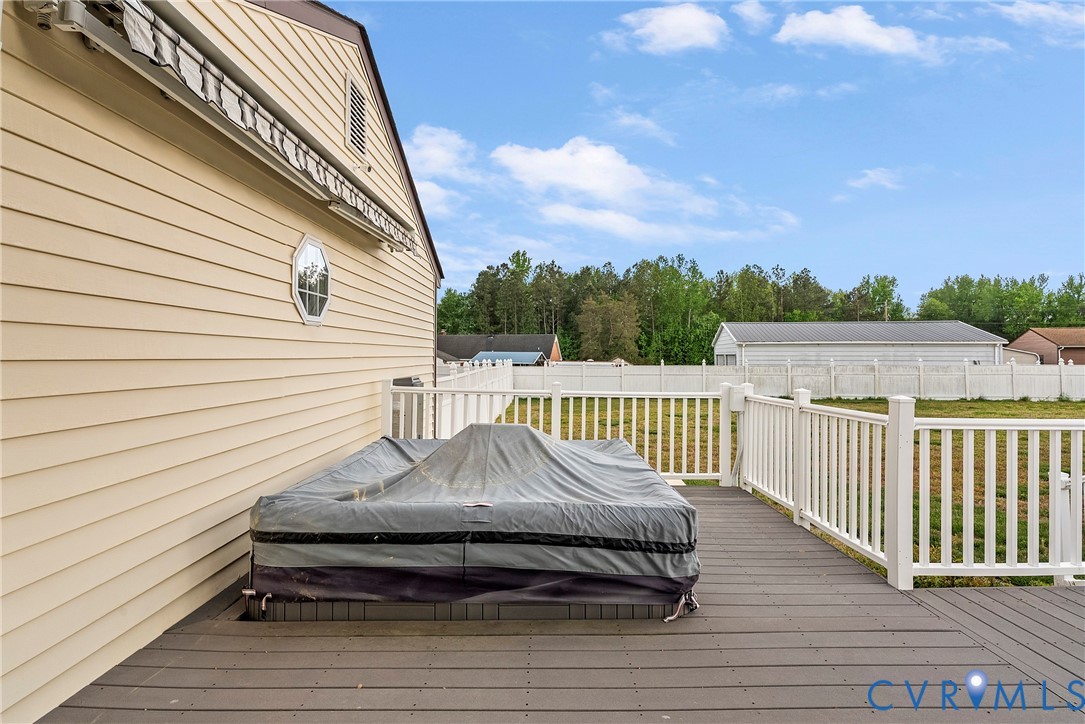 18024 Sandy Ford Road Petersburg, VA 23803 - Photo 37 of 66 a view of a roof deck with wooden floor and fence