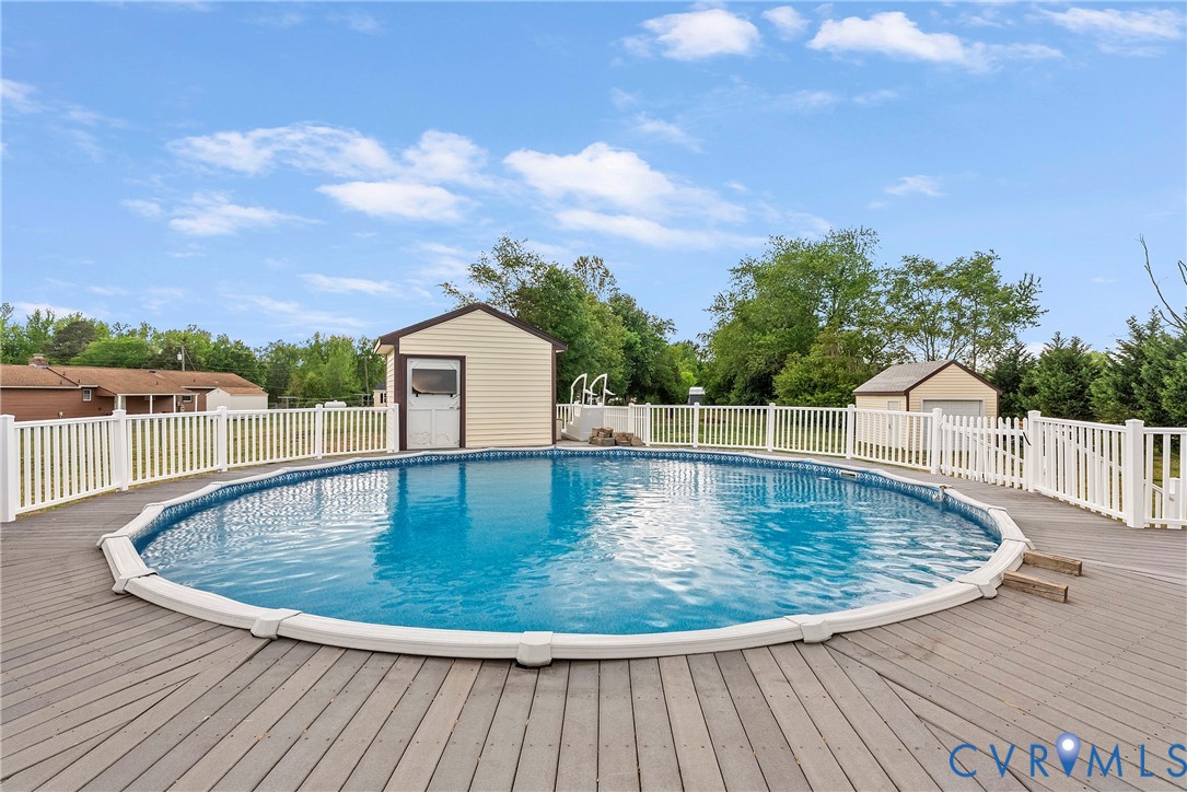 18024 Sandy Ford Road Petersburg, VA 23803 - Photo 47 of 66 a view of a swimming pool with a yard