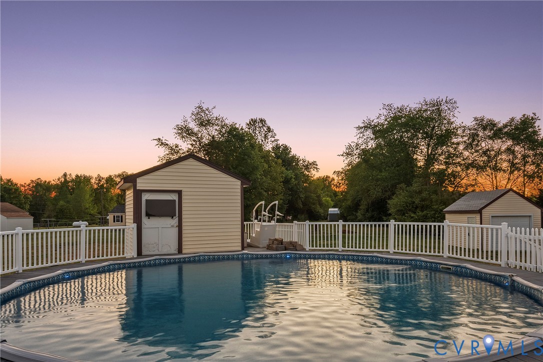 18024 Sandy Ford Road Petersburg, VA 23803 - Photo 48 of 66 a view of a swimming pool with a lake view