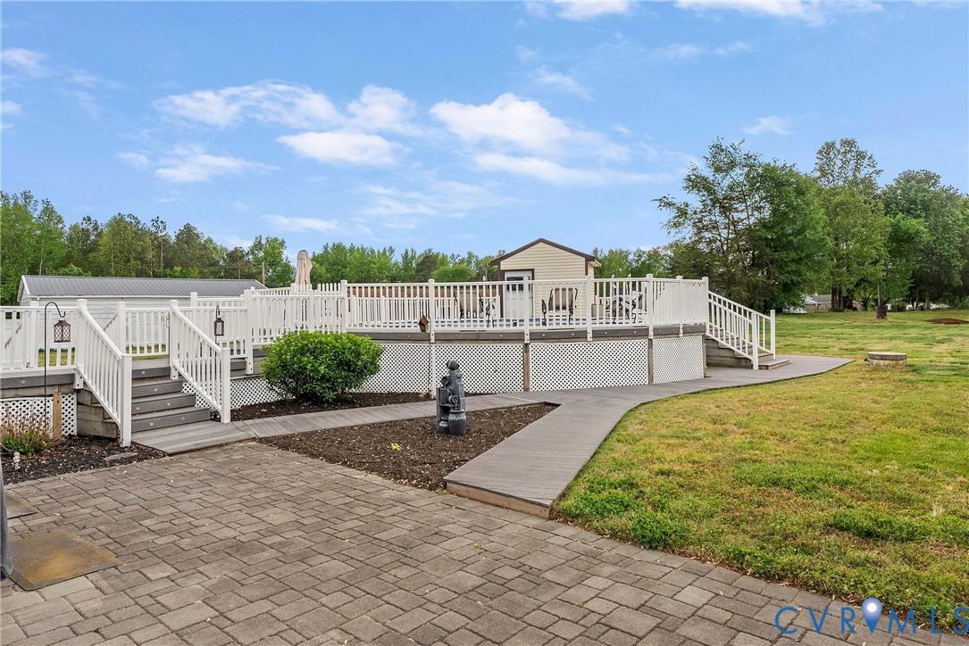 18024 Sandy Ford Road Petersburg, VA 23803 - Photo 52 of 66 a view of a terrace with a garden and deck