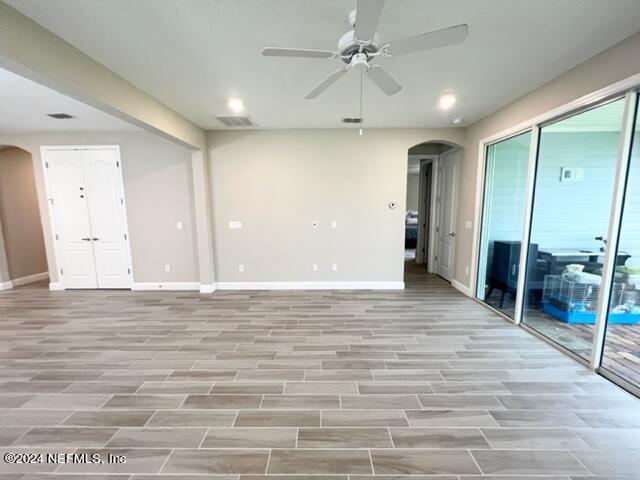 2333 Reese Way Jacksonville, FL 32246 - Photo 13 of 29 a view of a room with wooden floor and ceiling fan