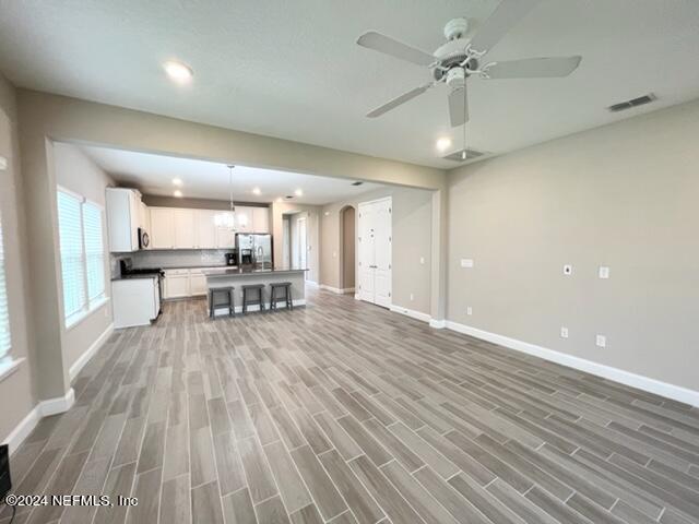 2333 Reese Way Jacksonville, FL 32246 - Photo 14 of 29 a view of a kitchen with furniture and wooden floor