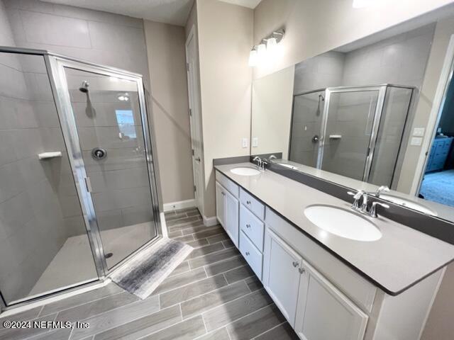 2333 Reese Way Jacksonville, FL 32246 - Photo 19 of 29 a bathroom with a double vanity sink mirror and shower