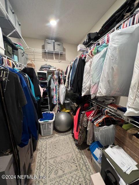2333 Reese Way Jacksonville, FL 32246 - Photo 23 of 29 a view of walk in closet with clothes and shoes