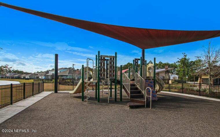 2333 Reese Way Jacksonville, FL 32246 - Photo 28 of 29 a view of a swimming pool with a bench