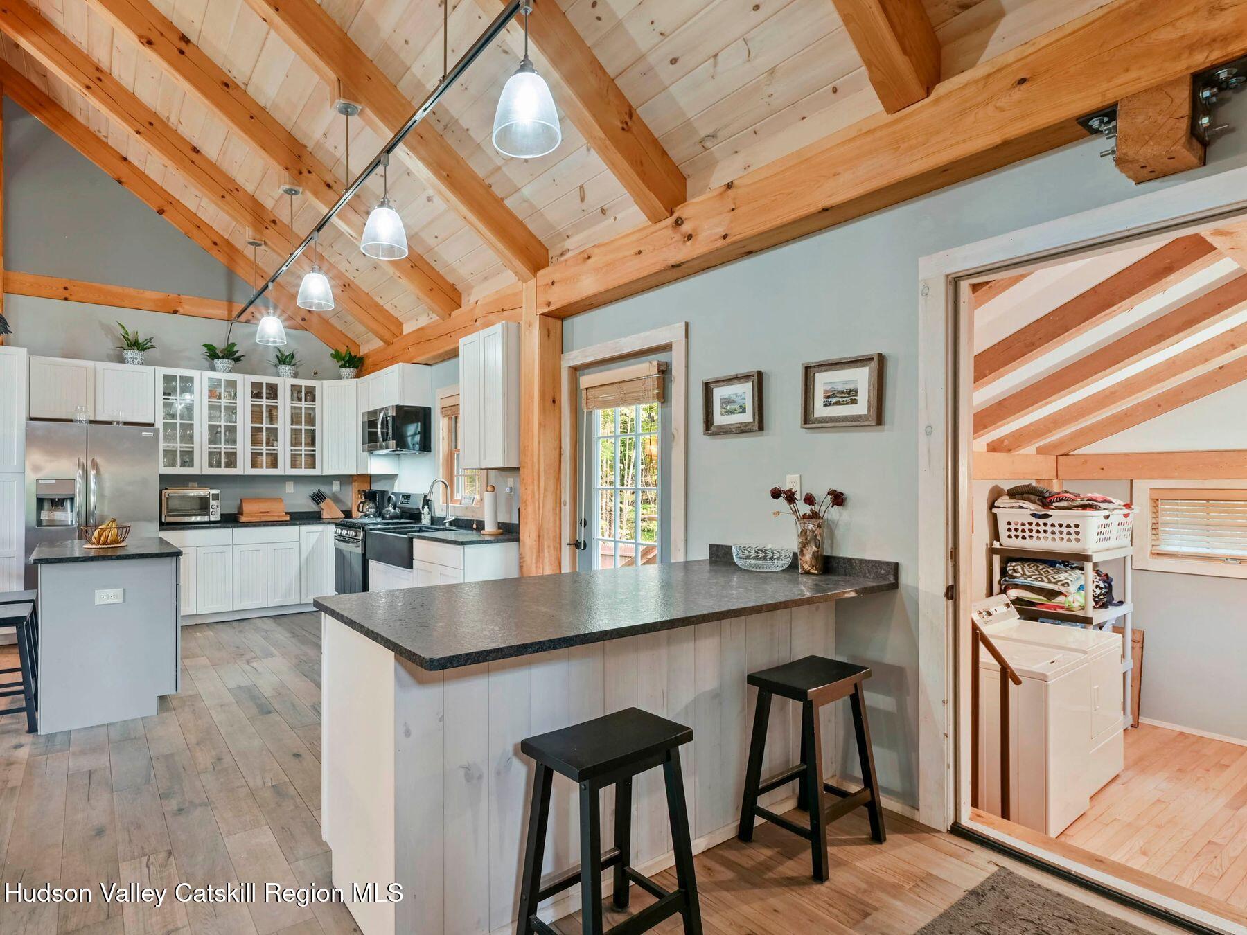 10 County Road Windham, NY 12496 - Photo 17 of 43 a living room with stainless steel appliances granite countertop furniture and a kitchen view