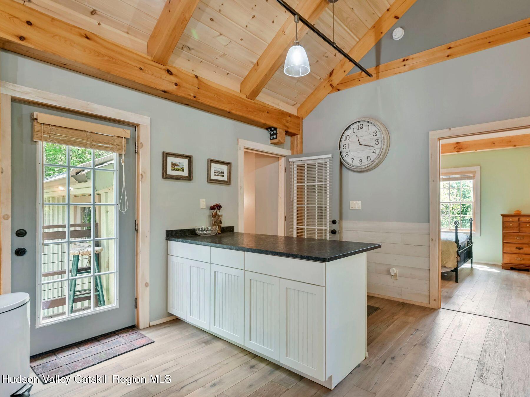 10 County Road Windham, NY 12496 - Photo 18 of 43 a kitchen with a sink and a clock on the wall