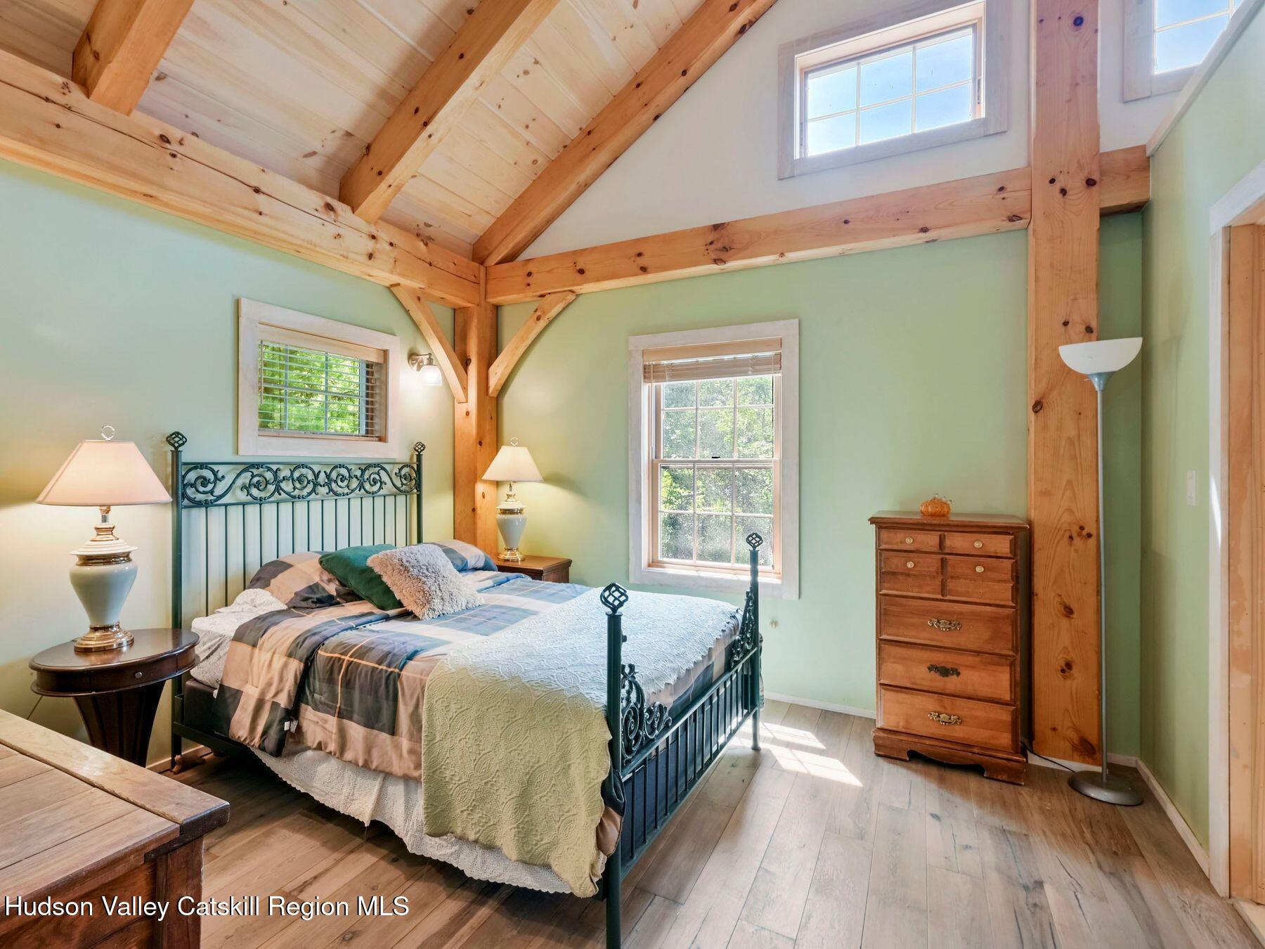 10 County Road Windham, NY 12496 - Photo 19 of 43 a bedroom with a bed and a dresser