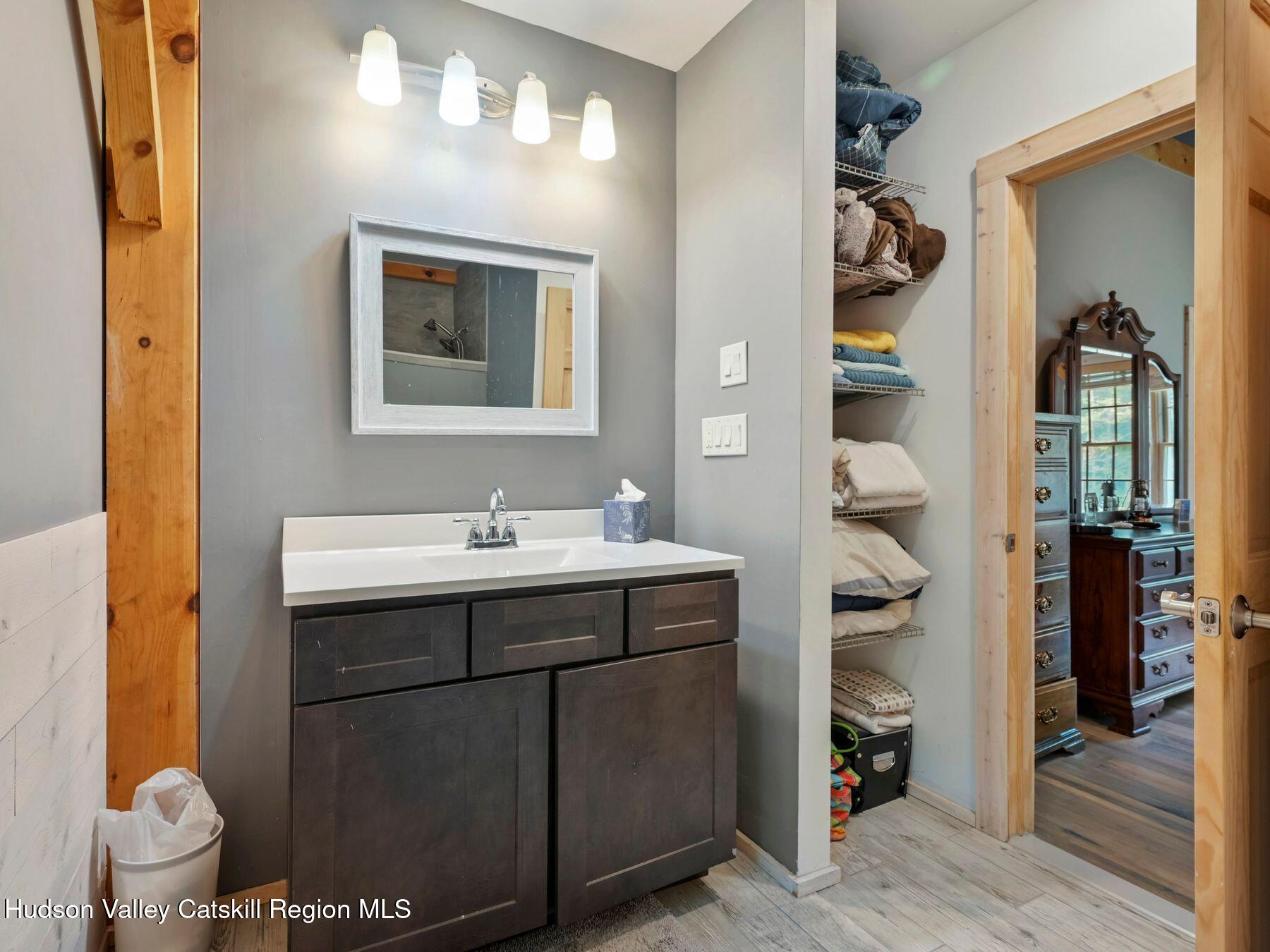 10 County Road Windham, NY 12496 - Photo 23 of 43 a bathroom with a sink and a mirror