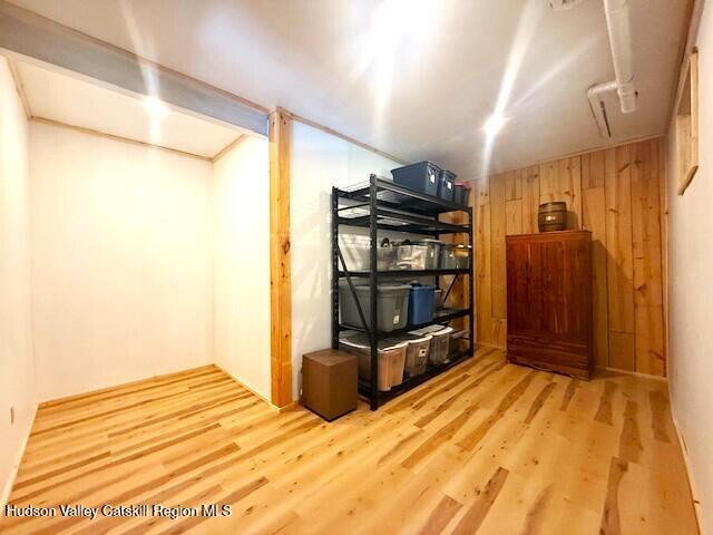 10 County Road Windham, NY 12496 - Photo 33 of 43 a bedroom with a bed and wooden floor