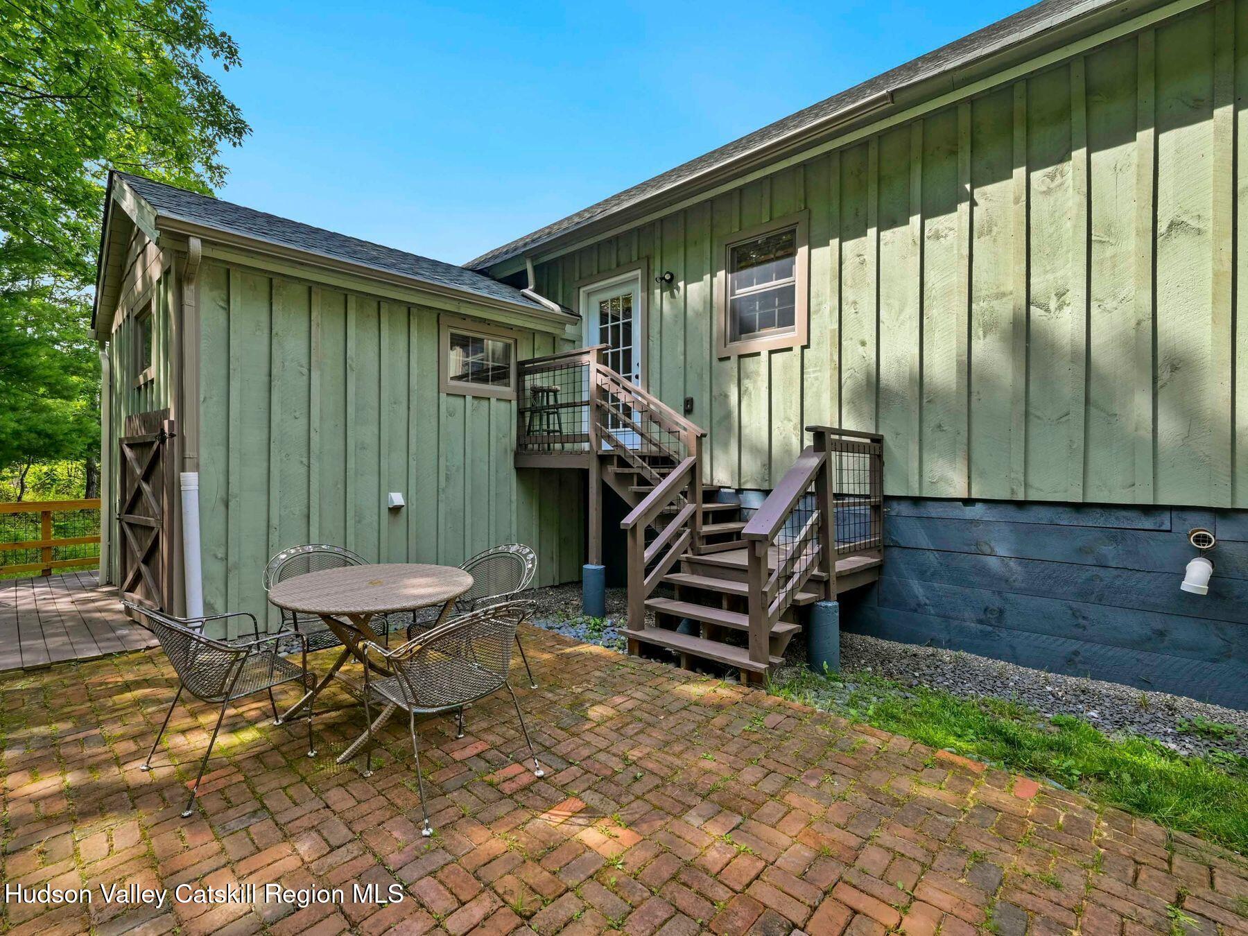 10 County Road Windham, NY 12496 - Photo 35 of 43 a backyard of a house with barbeque oven table and chairs