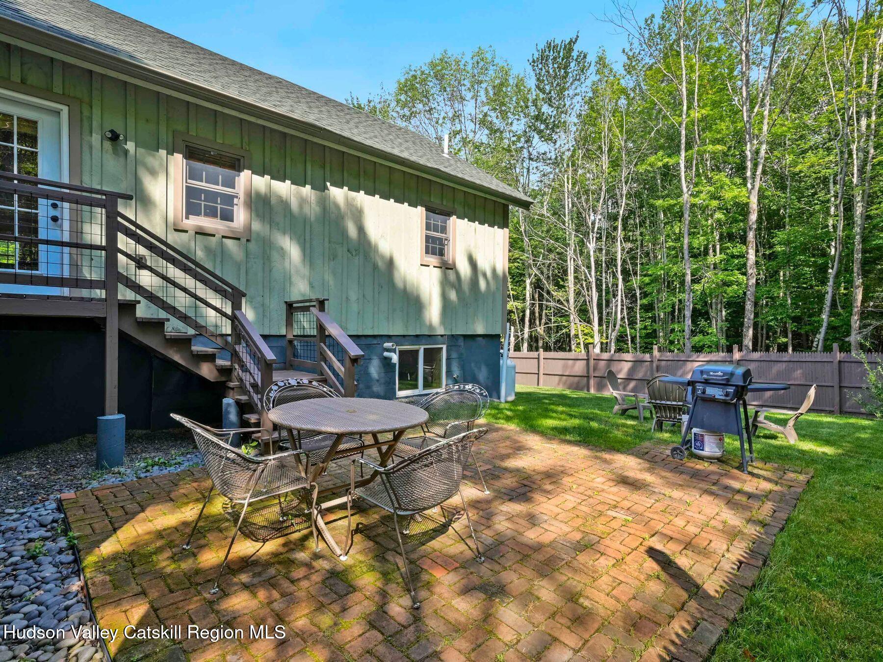 10 County Road Windham, NY 12496 - Photo 36 of 43 a view of a chairs and table in backyard of the house