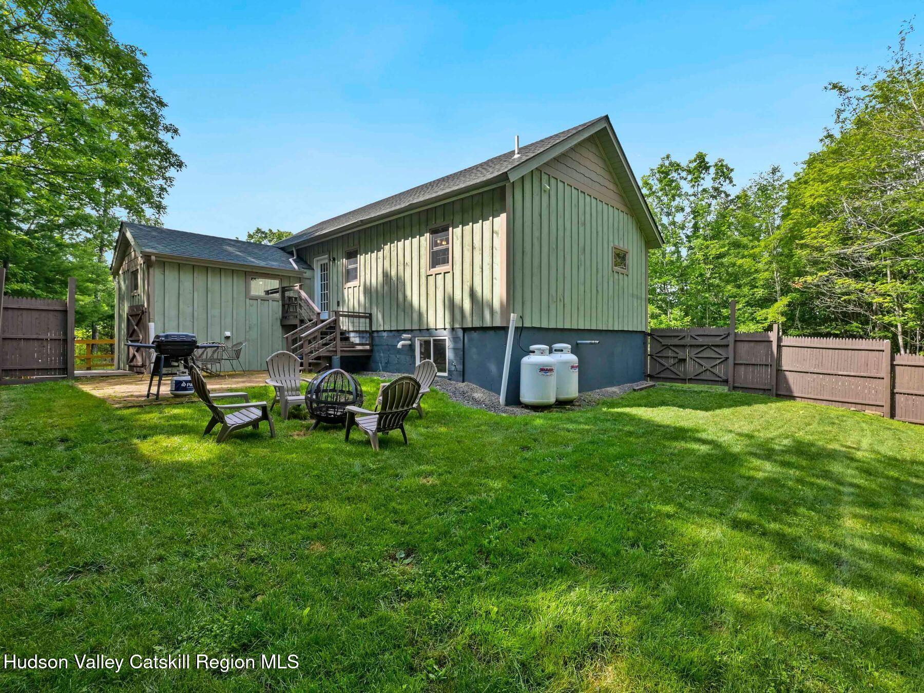 10 County Road Windham, NY 12496 - Photo 37 of 43 a backyard of a house with table and chairs