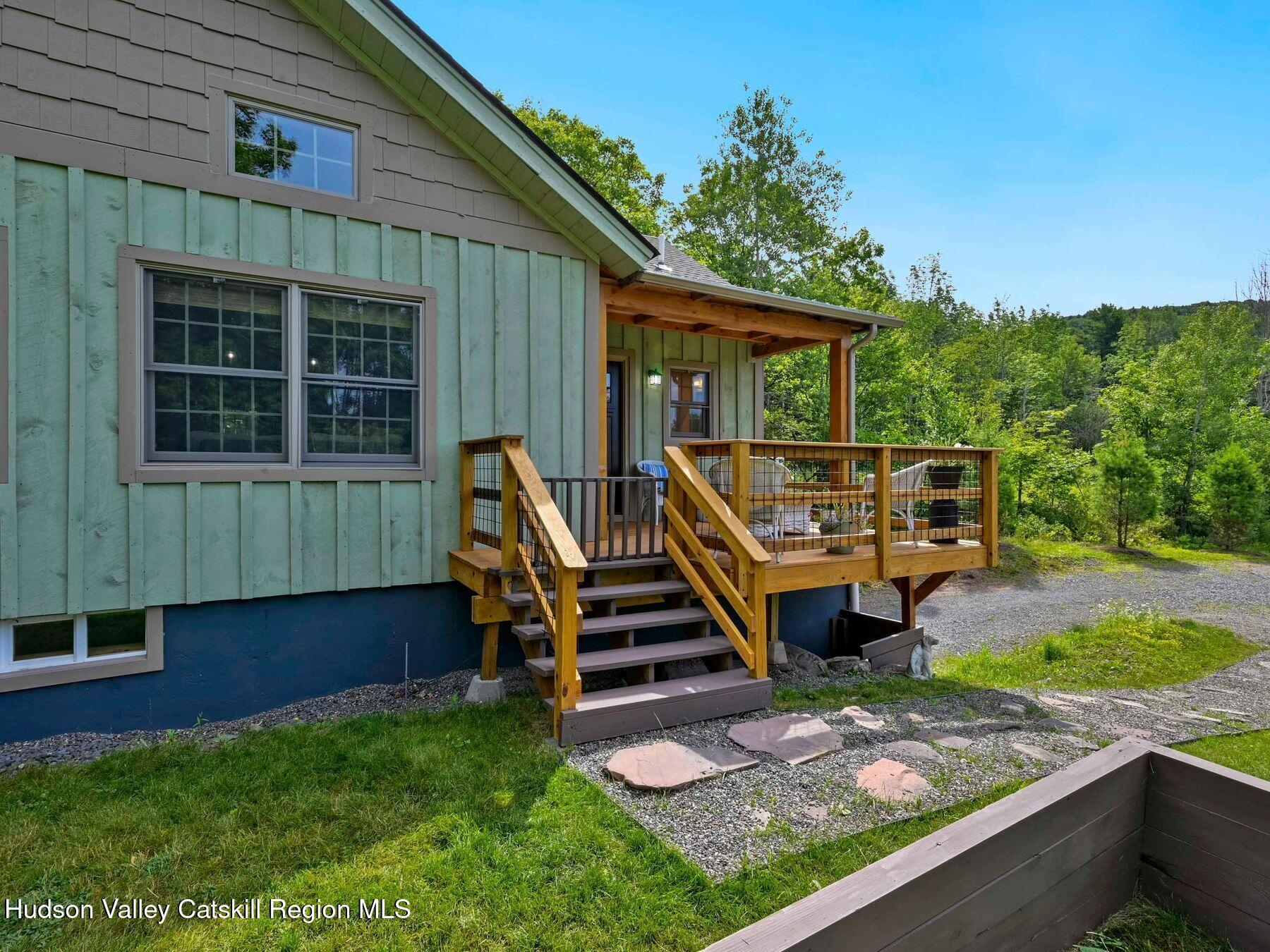 10 County Road Windham, NY 12496 - Photo 5 of 43 a front view of a house with a yard