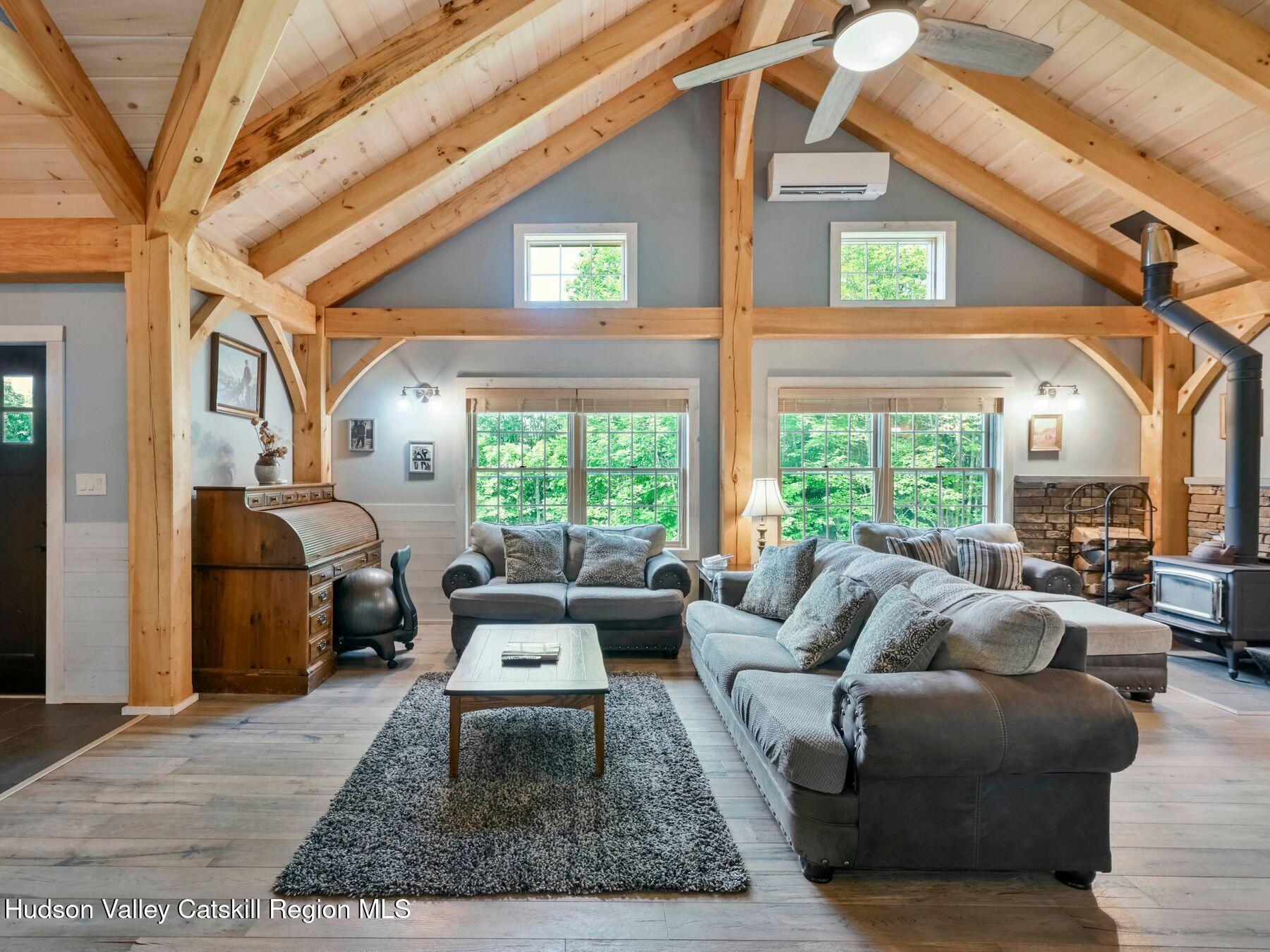 10 County Road Windham, NY 12496 - Photo 7 of 43 a living room with furniture and a large window