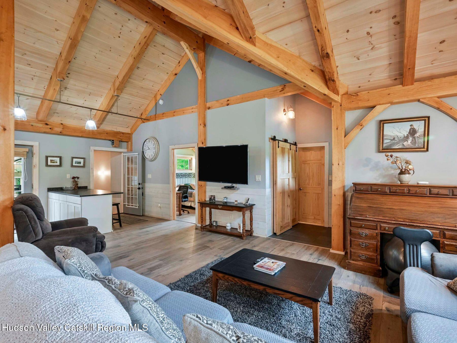 10 County Road Windham, NY 12496 - Photo 9 of 43 a living room with furniture and a flat screen tv