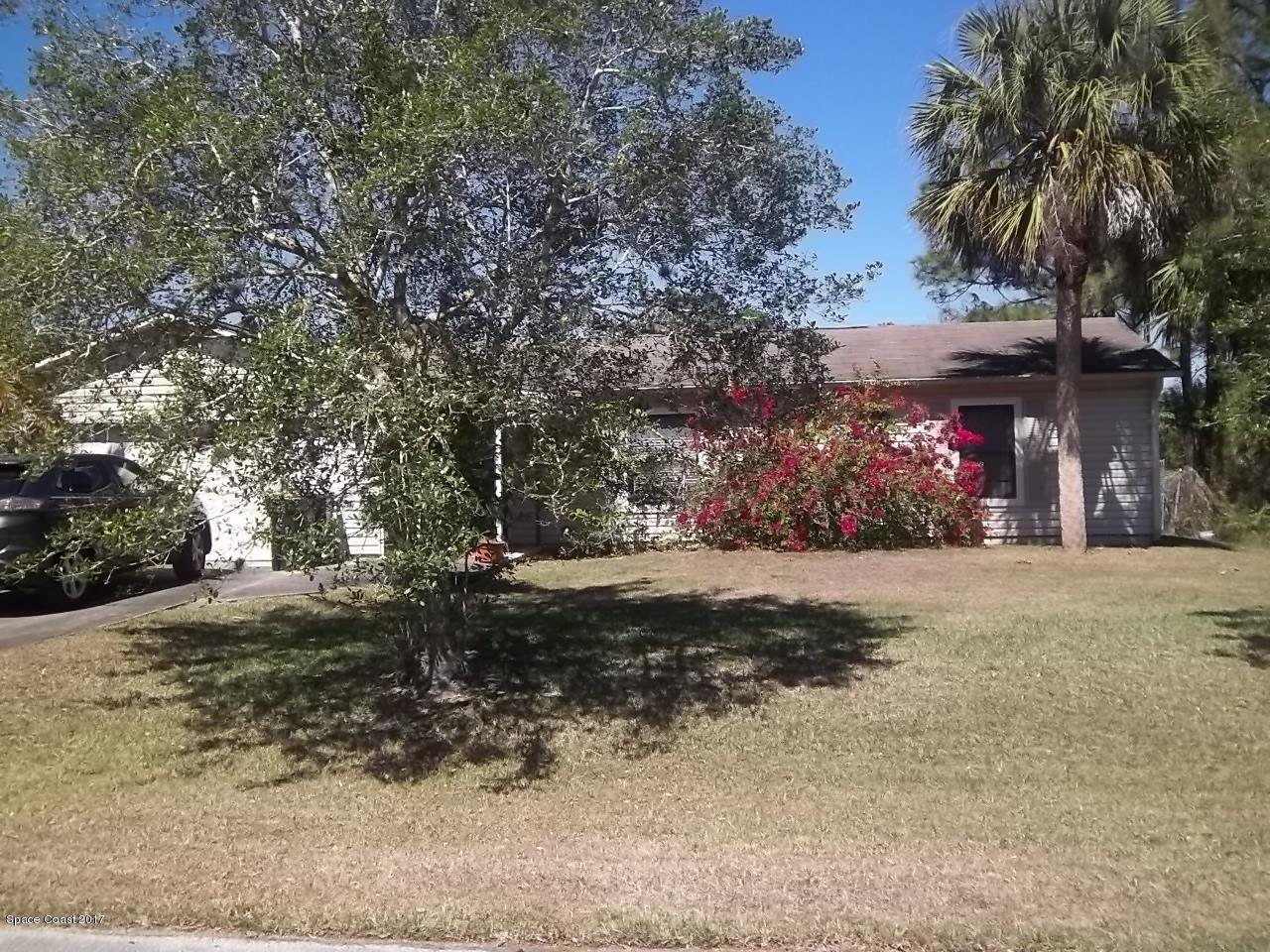 1081 Sapulpa Road Southwest Palm Bay, FL 32908 - Photo 1 of 10 a view of street and trees