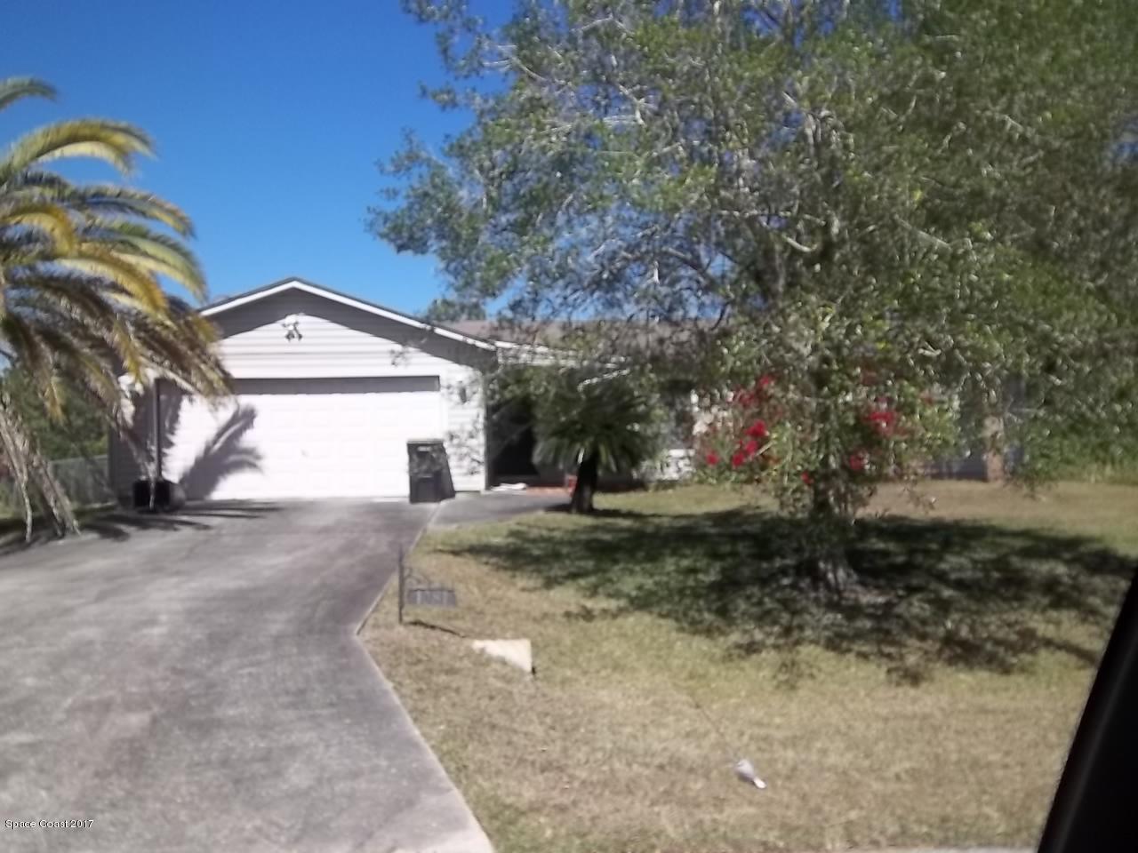 1081 Sapulpa Road Southwest Palm Bay, FL 32908 - Photo 10 of 10 a view of a yard with a house